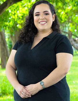 Diana in the nature wearing black t-shirt with a smiley face