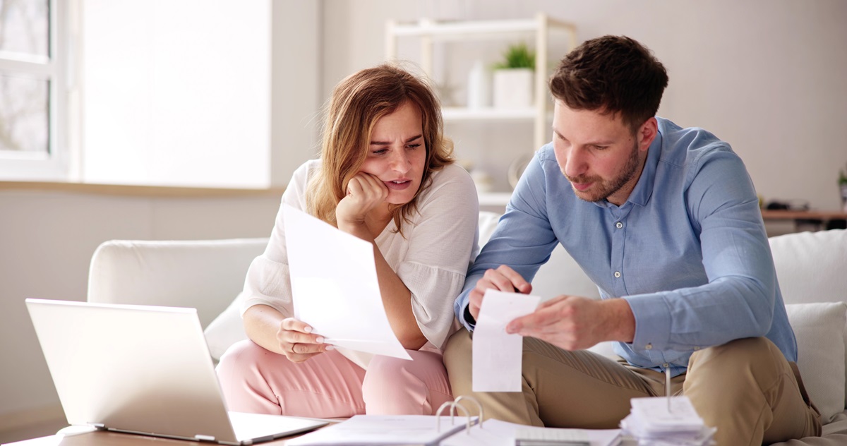 a man and woman looking at chapter 7 papers